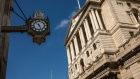 A clock hanging from the Royal Exchange building displays the time in view of the Bank of England (BOE) in the City of London, U.K., on Wednesday, May 6, 2020. Bank of England policy makers will meet this week knowing that they'll probably have to do more to combat the U.K.’s economic slump, if not now then soon. 