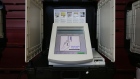 Diebold Election Systems Inc. electronic voting machine sits in a privacy booth at a polling location during the Georgia primary runoff elections in Atlanta, Georgia, U.S., on Tuesday, July 24, 2018 Photographer: Elijah Nouvelage/Bloomberg