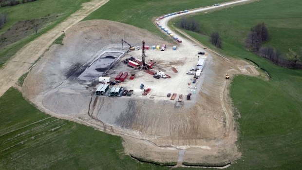 A vertical natural gas drilling rig and cutting impoundment is seen in Chartiers Township, Washington County, Pennsylvania.