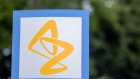 A sign featuring the AstraZeneca Plc logo stands near the company's DaVinci building at the Melbourn Science Park in Cambridge, U.K., on Monday, June 8, 2020. 