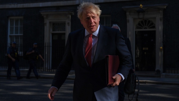 Boris Johnson, U.K. prime minister, arrives for the first in-person cabinet meeting since U.K. Prime Minister Boris Johnson encouraged people to return to work in London, U.K., on Tuesday, July 21, 2020. Senior lawmakers will seek to use a visit to London by U.S. Secretary of State Michael Pompeo to press Johnson to take an even harder stance on China.