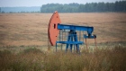 An oil pumping jack, also known as "nodding donkey", operates in an oilfield near Almetyevsk, Russia, on Sunday, Aug. 16, 2020