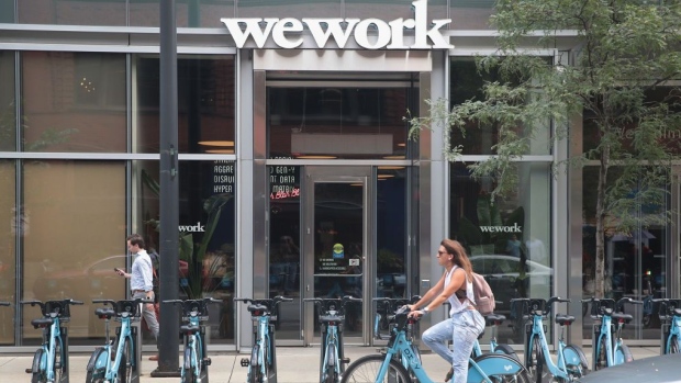 A sign marks the location of a WeWork office facility on August 14, 2019 in Chicago, Illinois. WeWork, a real estate firm that leases shared office space, announced today that it had filed a financial prospectus with regulators to become a publicly traded company. 
