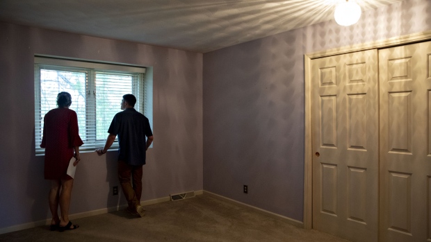 A real estate agent shows a prospective home buyer a house for sale in Peoria, Illinois, U.S., on Thursday, May 30, 2019. The National Association of Realtors is scheduled to release existing homes sales figures on June 21.