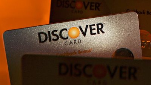 A Discover Financial Services chip credit card is arranged for a photograph in Washington, D.C., U.S., on Friday, Oct. 20, 2017. Discover Financial Services is scheduled to release earning figures on October 24. Photographer: Andrew Harrer/Bloomberg