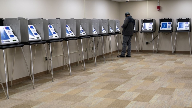 A voter casts a ballot early in a polling station at the Montgomery County Board of Elections in Dayton, Ohio.