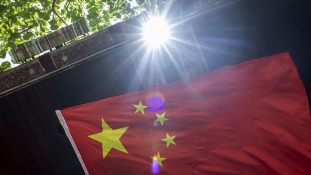 The flag of China is displayed on a street in the Tsim Sha Tsui district in Hong Kong, China, on Monday, June 29, 2020. The national security law that China could impose on Hong Kong as early as this week won't need to be used if the financial hub's residents avoid crossing certain "red lines," according to Bernard Chan, a top adviser to Hong Kong Chief Executive Carrie Lam. Photographer: Paul Yeung/Bloomberg