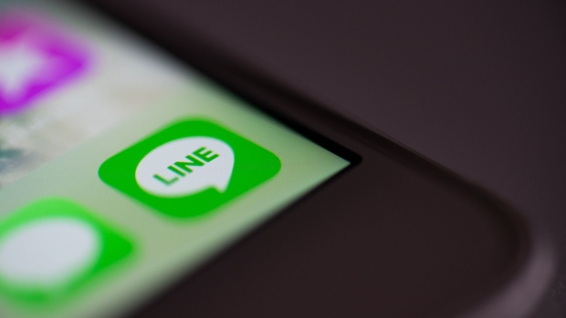 The icon for Line Corp.'s Line app is displayed on a smartphone in this arranged photograph in Kawasaki, Kanagawa Prefecture, Japan, on Thursday, Jan. 31, 2019. Line Corp. posted fourth-quarter net income of 2.35 billion yen, beating estimates. Photographer: Akio Kon/Bloomberg