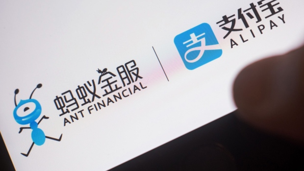 The loading page for Ant Financial Services Group's Alipay application, an affiliate of Alibaba Group Holding Ltd., is displayed on an Apple Inc. iPhone in an arranged photograph taken in Hong Kong, China, on Wednesday, July 26, 2017. Alibaba is scheduled to release second-quarter earnings figures on Aug 10. Photographer: Anthony Kwan/Bloomberg