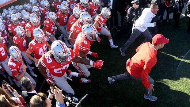 The Ohio State Buckeyes run on to the field during the Rose Bowl Game in 2019. Photographer: Harry How/Getty Images