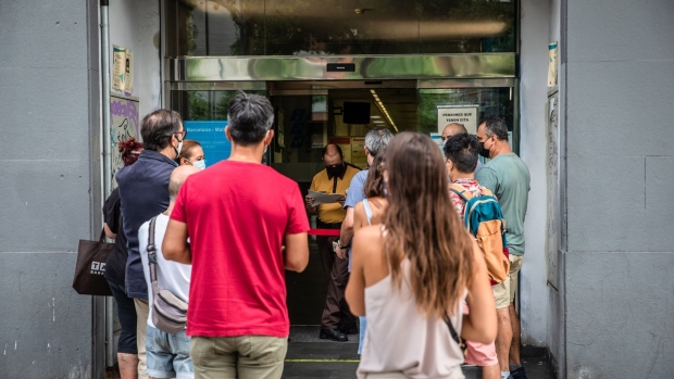 Job seekers queue for their appointments outside a regional employment office in Barcelona, Spain, on Wednesday, Aug. 12, 2020. Spain's unemployment rate rose in the second quarter, a harbinger of the bleak months ahead for one of Europe’s most troubled labor markets. Photographer: Angel Garcia/Bloomberg
