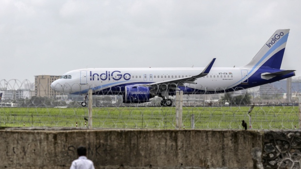 An aircraft operated by IndiGo, a unit of InterGlobe Aviation Ltd., prepares to take off at Chhatrapati Shivaji International Airport in Mumbai.