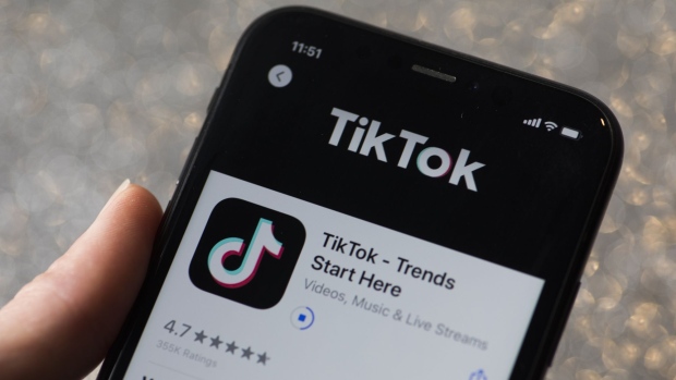 The download page for ByteDance Ltd.'s TikTok app is arranged for a photograph on a smartphone in Sydney, New South Wales, Australia, on Monday, Sept. 14, 2020. Oracle Corp. is the winning bidder for a deal with TikTok’s U.S. operations, people familiar with the talks said, after main rival Microsoft Corp. announced its offer for the video app was rejected.