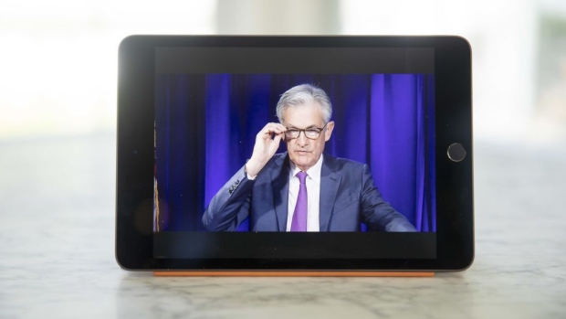 Jerome Powell, chairman of the U.S. Federal Reserve, speaks during a virtual news conference seen on a tablet computer in Tiskilwa, Illinois, U.S., on Wednesday, Sept. 16, 2020. The Federal Reserve left interest rates near zero and signaled it would hold them there through at least 2023 to help the U.S. economy recover from the coronavirus pandemic.