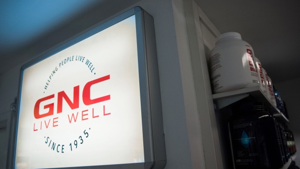Signage is displayed inside a GNC Holdings Inc. store in New York, U.S., on Thursday, Oct. 26, 2017. GNC Holdings Inc. released earnings figures on October 26. Photographer: Mark Kauzlarich/Bloomberg