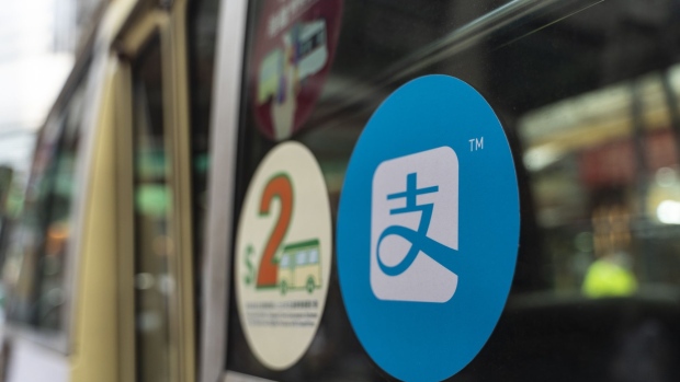 A sign for digital payment service Alipay by Ant Group, an affiliate of Alibaba Group Holding Ltd., is displayed on a public bus in Hong Kong, China, on Tuesday, Sept. 1, 2020. Billionaire Jack Ma's Ant Group is poised to pull off what could be the biggest initial public offering ever by simultaneously listing in Hong Kong and Shanghai. Photographer: Chan Long Hei/Bloomberg