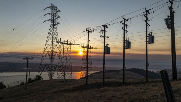 Power lines and transmission towers at sunrise in Crockett, California, U.S., on Aug. 19.