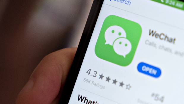 The Tencent Holdings Ltd. WeChat app is displayed in the App Store on a smartphone in an arranged photograph taken in Arlington, Virginia, U.S., on Friday, Aug. 7, 2020. President Donald Trump signed a pair of executive orders prohibiting U.S. residents from doing business with the Chinese-owned TikTok and WeChat apps beginning 45 days from now, citing the national security risk of leaving Americans' personal data exposed.