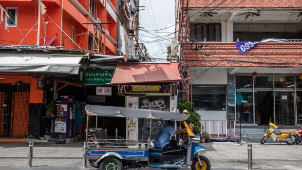 A tuk tuk driver waits for a customer at a near-empty Khao San Road in Bangkok, Thailand, on Wednesday, Sept. 2, 2020. Thailand has reported zero locally-transmitted Covid-19 cases for 100 days in a row, joining a small group of places like Taiwan where the pathogen has been virtually eliminated. Photograph: Taylor Weidman/Bloomberg