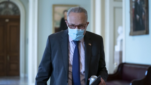 Senate Minority Leader Chuck Schumer, a Democrat from New York, wears a protective mask as he walks through the U.S. Capitol in Washington, D.C., U.S., on Tuesday, Sept. 15, 2020. The House Speaker today said Congress should stay in session until lawmakers and the White House get an agreement on another stimulus package, something that's looked increasingly distant amid partisan battling.