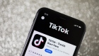 The download page for ByteDance Ltd.'s TikTok app is arranged for a photograph on a smartphone in Sydney, New South Wales, Australia, on Monday, Sept. 14, 2020. 