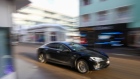 A Tesla Inc. Model S electric automobile drives along the promenade ahead of the World Economic Forum (WEF) in Davos, Switzerland, on Sunday, Jan. 19, 2020. World leaders, influential executives, bankers and policy makers attend the 50th annual meeting of the World Economic Forum in Davos from Jan. 21 - 24. Photographer: Simon Dawson/Bloomberg
