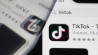 The download page for ByteDance Ltd.'s TikTok app is arranged for a photograph on a smartphone in Sydney, New South Wales, Australia, on Monday, Sept. 14, 2020. Oracle Corp. is the winning bidder for a deal with TikTok’s U.S. operations, people familiar with the talks said, after main rival Microsoft Corp. announced its offer for the video app was rejected.