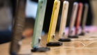 A row of Apple Inc. iPhone 11 smartphones