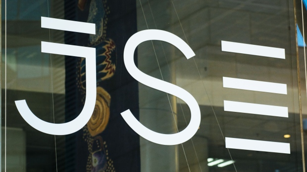 A logo sits on a glass door in the Johannesburg Stock Exchange (JSE) in the Sandton district of Johannesburg, South Africa, on Monday, Sept. 3, 2018. The emerging-market sell-off may have already battered South Africa's rand, but it could get worse as traders fret about a push for land reform that may have far-reaching economic consequences and is catching the attention of world leaders.