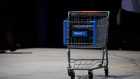 A shopping cart outside a Walmart store in Lakewood, California, U.S., on Thursday, July 16, 2020. Walmart Inc. will require customers to wear masks in all of its U.S. stores to protect against the coronavirus, an admission that the nation's pandemic has reached new heights and setting up potential confrontations with customers who refuse to don them. Photographer: Patrick T. Fallon/Bloomberg
