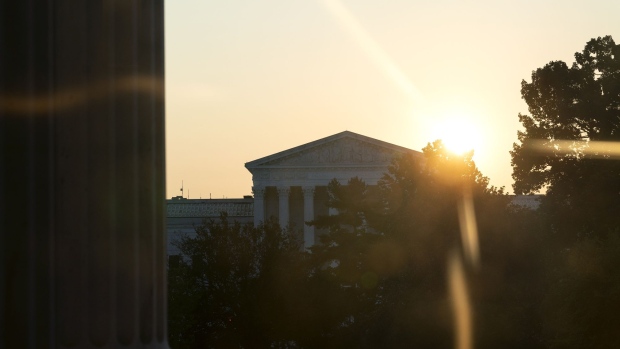 The sun rises behind the U.S. Supreme Court before a ceremony for late Supreme Court Justice Ruth Bader Ginsburg in Washington, D.C. on Sept. 23.