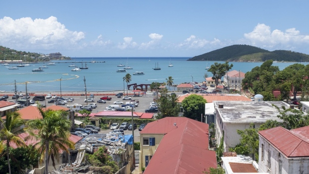 Boats sit in a bay in St. Thomas, U.S. Virgin Islands, on Thursday, July 11, 2019. Little St. James Island is where Epstein –- convicted of sex crimes a decade ago in Florida and now charged in New York with trafficking girls as young as 14 –- repaired, his escape from the toil of cultivating the rich and powerful. Photographer: Marco Bello/Bloomberg