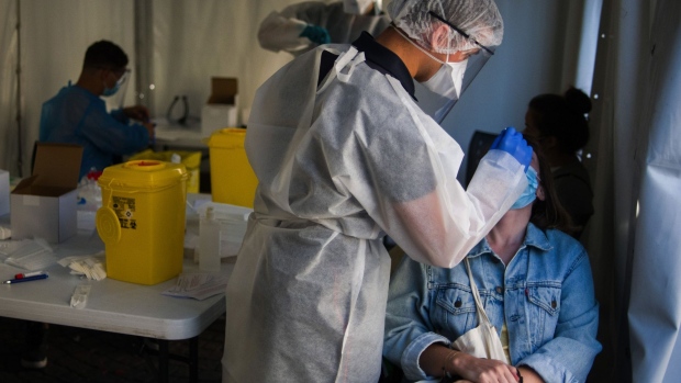 A medic administers a Covid-19 swab test on a patient in a pop-up testing tent in Paris on Sept. 21. 
