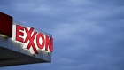 Signage is displayed at an Exxon Mobil Corp. gas station in Falls Church, Virginia, U.S., on Tuesday, April 28, 2020.