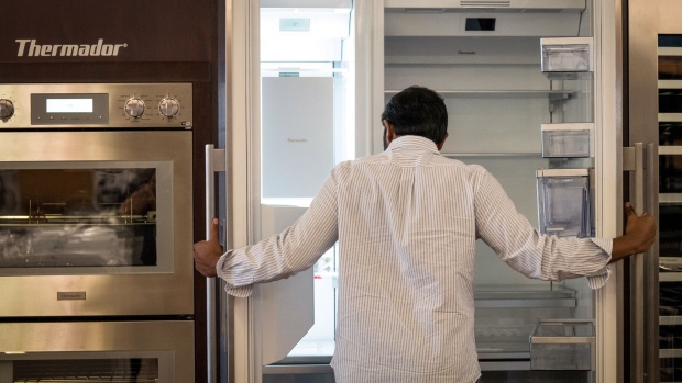 A customer views a refrigerator displayed for sale at an appliance store in San Jose, California.