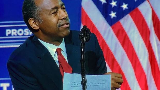 U.S. Housing and Urban Development Secretary Ben Carson's notes are partially visible as he appears at an event with President Donald Trump in Atlanta on Sept. 25, 2020.