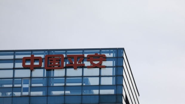 Signage for Ping An Insurance Group Co. is displayed atop a building in Beijing, China, on Thursday, March 14, 2019. 