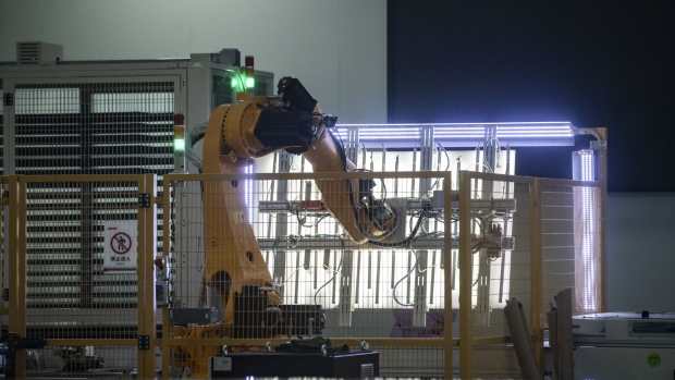 A robotic arm operates in the Longi Green Energy Technology Co. solar panel factory in Xi'an, Shaanxi Province, China, on Monday, July 20, 2020. Longi is the world's largest producer of solar wafers and the world's largest solar company by market value. Photographer: Qilai Shen/Bloomberg