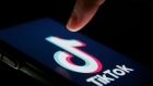 The TikTok logo is displayed on a smartphone in this arranged photograph in London, U.K., on Monday, Aug. 3, 2020.
