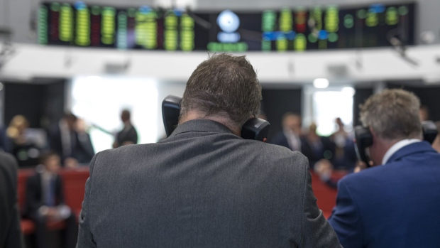 A trader speaks on fixed-line telephones on the trading floor of the open outcry pit at the London Metal Exchange Ltd. (LME) in London, U.K. on Wednesday, Sept. 25, 2019.