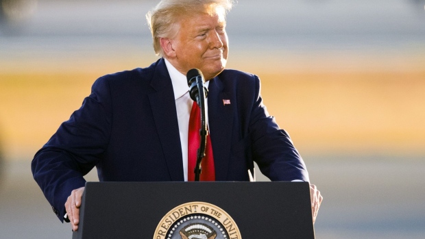 U.S. President Donald Trump smiles during a campaign rally at the Pro Star Aviation hangar in Londonderry, New Hampshire, U.S., on Friday, Aug. 28, 2020. Trump took aim at people protesting racism and police brutality, saying they are “just looking for trouble” and don’t know about the killing of a Black man at the hands of police in Minneapolis that led to demonstrations nationally.
