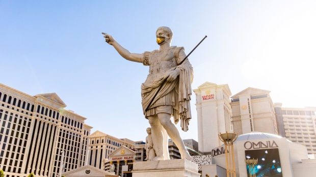 A statue of Julius Caesar wears a mask at the entrance of the Caesars Entertainment Caesars Palace hotel and casino in Las Vegas on July 28.