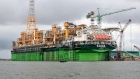 The Total SA 'Egina' floating production, storage and offloading oil vessel (FPSO), sits docked at the Ladol free trade zone port in Lagos, Nigeria, on Tuesday, May 22, 2018. Ladol, a logistics hub for the offshore oil industry in Lagos, Nigeria, is mulling a stock-market listing and corporate bonds to expand its facilities and get more business from major production companies. Photographer: George Osodi/Bloomberg