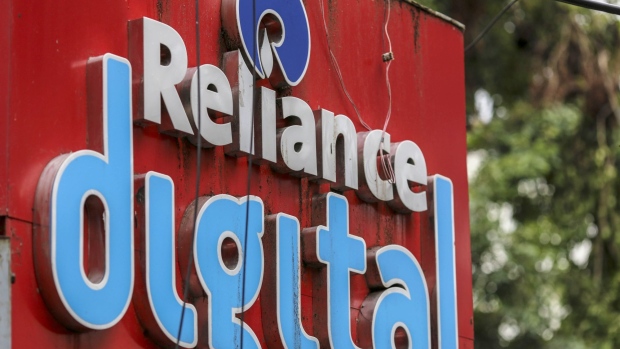 Signage for Reliance Digital Retail Ltd., a subsidiary of Reliance Industries Ltd., is displayed outside a company store in Mumbai, India, on Tuesday, July 14, 2020. Google is in advanced talks to buy a $4 billion stake in Jio Platforms Ltd., the digital arm of Indian billionaire Mukesh Ambani's conglomerate, people familiar with the matter said, seeking to join rival Facebook Inc. in chasing growth in a promising internet and e-commerce market. Photographer: Dhiraj Singh/Bloomberg