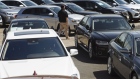 A salesman surveys the lot at a used car dealership in Jersey City, New Jersey, on May 20. 
