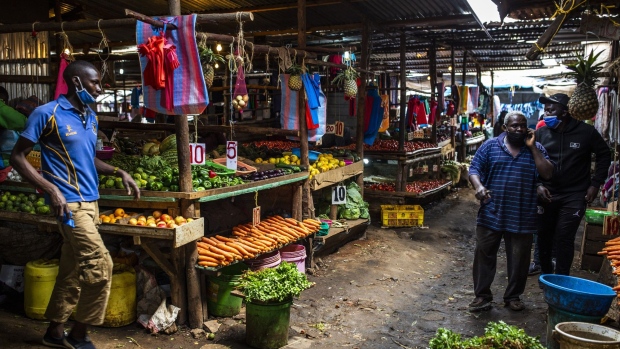 Customers browse fresh produce on sale at Toi market in Nairobi, Kenya, on Tuesday, May 26, 2020. Kenya plans to spend 53.7 billion shillings ($503 million) on a stimulus package to support businesses that have been hit by the coronavirus pandemic, according to the National Treasury.