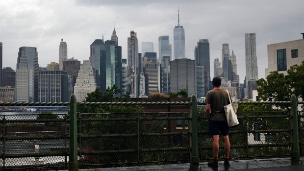 A man looks out at the Manhattan skyline in a Brooklyn neighborhood on September 29.