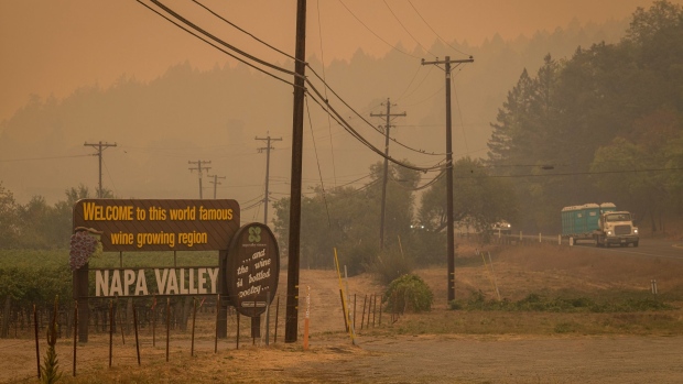A Napa Valley welcome sign in the smoke filled the air from the Glass Fire in St. Helena, California, on Sept. 28.