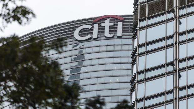 The Citigroup Inc. logo is displayed atop the Champion Tower, left, in Hong Kong, China, on Saturday, March 23, 2019. Citigroup, the global investment bank with a major presence in Asia, has ousted eight equities traders in Hong Kong and suspended three others after a sweeping internal investigation into its dealings with some clients, people familiar with the matter said. Photographer: Justin Chin/Bloomberg