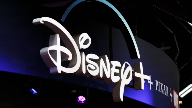 Signage for the Disney+ streaming service is displayed during the D23 Expo 2019 in Anaheim, California, U.S., on Friday, Aug. 23, 2019. 